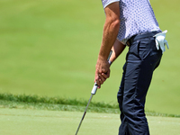 Lanto Griffin of Jacksonville Beach, Florida lines up his putt on the 18th green during the first round of the The Memorial Tournament prese...