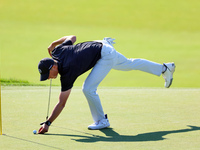 Tyrrell Hatton of High Wycombe, England picks up his ball after putting on the 18th green during the first round of the The Memorial Tournam...