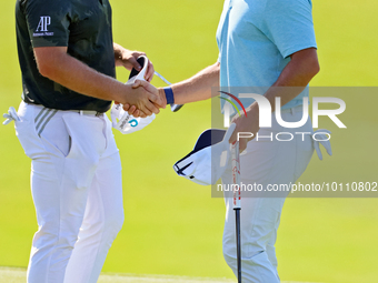 Rory McIlroy of Holywood, NIR shakes hands with Tyrrell Hatton of High Wycombe, England after completing the first round of the The Memorial...