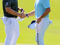 Rory McIlroy of Holywood, NIR shakes hands with Tyrrell Hatton of High Wycombe, England after completing the first round of the The Memorial...