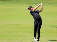 Danny Willett of Sheffield, England hits from the 17th green during the first round of the The Memorial Tournament presented by Workday at M...