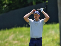 Cam Davis of Sydney, Australia reacts to his fairway shot during the first round of the The Memorial Tournament presented by Workday at Muir...