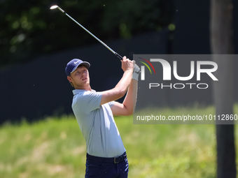 Cam Davis of Sydney, Australia hits on the 15th fairway during the first round of the The Memorial Tournament presented by Workday at Muirfi...