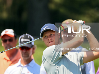 Cam Davis of Sydney, Australia hits from the 16th tee during the first round of the The Memorial Tournament presented by Workday at Muirfiel...