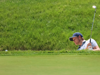 Cam Davis of Sydney, Australia chips onto the 16th green from the bunker during the first round of the The Memorial Tournament presented by...