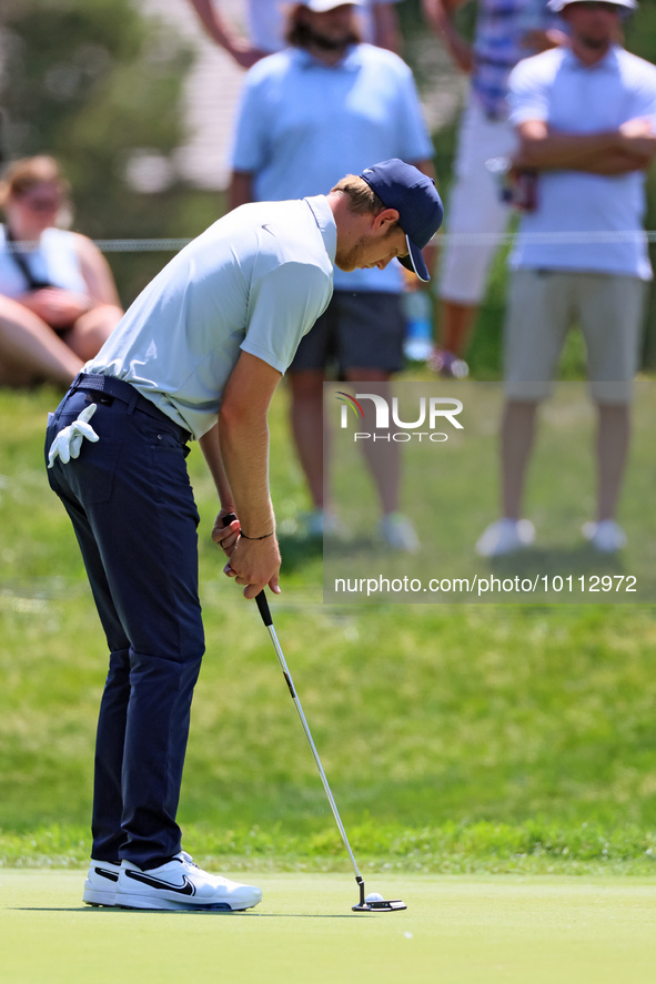 Cam Davis of Sydney, Australia putts on the 16th green from the bunker during the first round of the The Memorial Tournament presented by Wo...