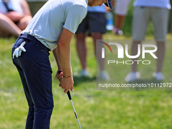 Cam Davis of Sydney, Australia putts on the 16th green from the bunker during the first round of the The Memorial Tournament presented by Wo...