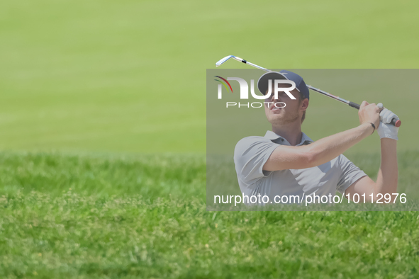 Cam Davis of Sydney, Australia follows his shot toward the 17th green  from the bunker during the first round of the The Memorial Tournament...