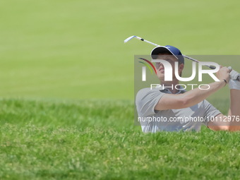 Cam Davis of Sydney, Australia follows his shot toward the 17th green  from the bunker during the first round of the The Memorial Tournament...