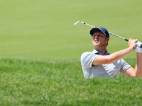 Cam Davis of Sydney, Australia follows his shot toward the 17th green  from the bunker during the first round of the The Memorial Tournament...