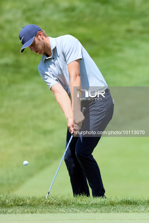 Cam Davis of Sydney, Australia follows chips onto the 18th green  from the bunker during the first round of the The Memorial Tournament pres...