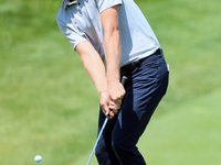 Cam Davis of Sydney, Australia follows chips onto the 18th green  from the bunker during the first round of the The Memorial Tournament pres...