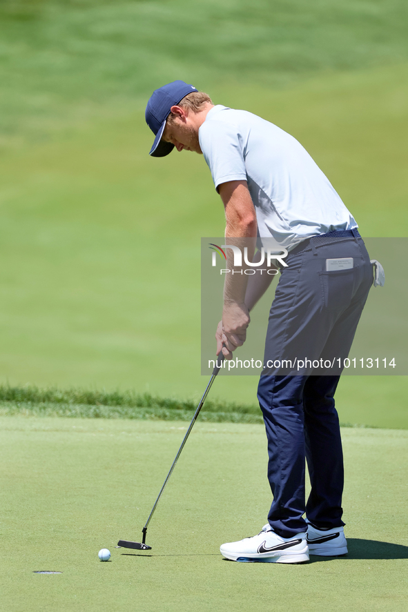 Cam Davis of Sydney, Australia putts on the 18th green  from the bunker during the first round of the The Memorial Tournament presented by W...