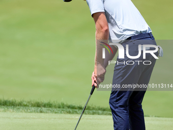 Cam Davis of Sydney, Australia putts on the 18th green  from the bunker during the first round of the The Memorial Tournament presented by W...