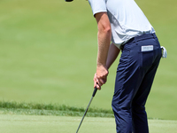 Cam Davis of Sydney, Australia putts on the 18th green  from the bunker during the first round of the The Memorial Tournament presented by W...