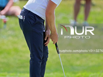 Matt Wallace of England follows putts on the 17th green during the first round of the The Memorial Tournament presented by Workday at Muirfi...