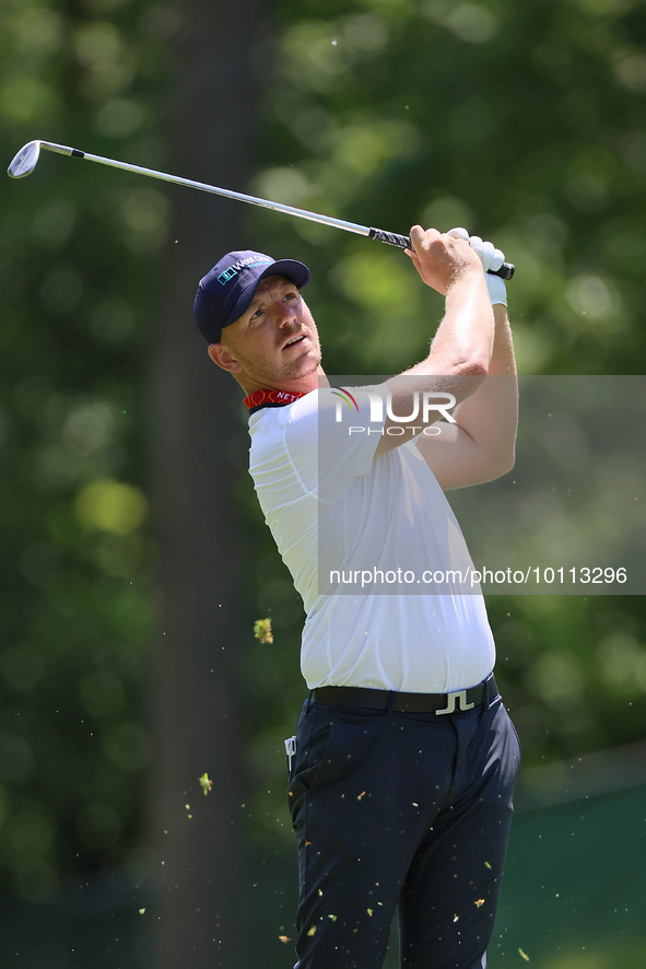 Matt Wallace of England hits from the 15th fairway to the green during the first round of the The Memorial Tournament presented by Workday a...