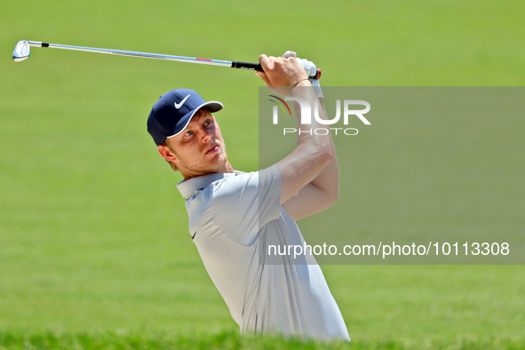 Cam Davis of Sydney, Australia hits from the bunker on the 15th fairway during the first round of the The Memorial Tournament presented by W...