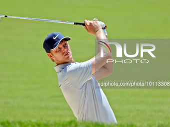 Cam Davis of Sydney, Australia hits from the bunker on the 15th fairway during the first round of the The Memorial Tournament presented by W...