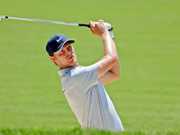 Cam Davis of Sydney, Australia hits from the bunker on the 15th fairway during the first round of the The Memorial Tournament presented by W...