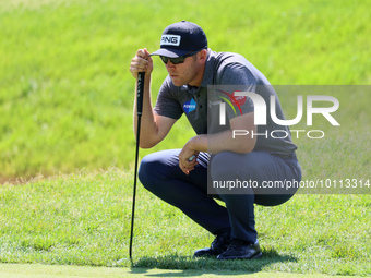 Seamus Power of Waterford, Ireland hits lines up his putt on the 15th green during the first round of the The Memorial Tournament presented...