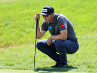 Seamus Power of Waterford, Ireland hits lines up his putt on the 15th green during the first round of the The Memorial Tournament presented...