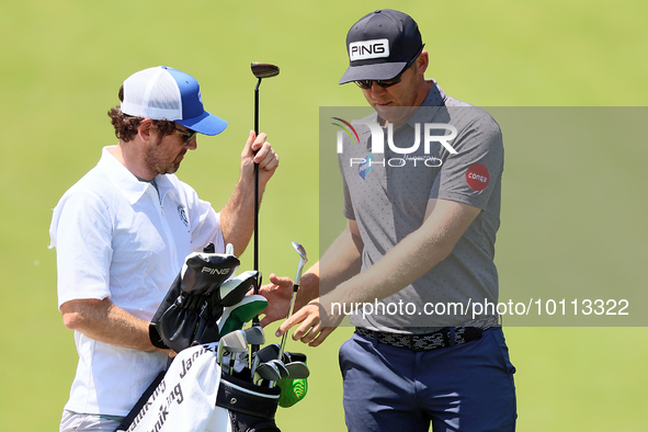 Seamus Power of Waterford, Ireland chips exchanges clubs at the 17th green during the first round of the The Memorial Tournament presented b...