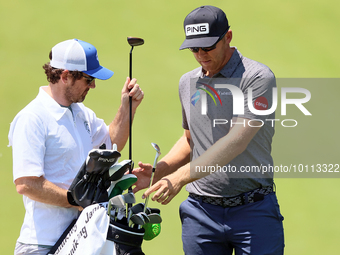 Seamus Power of Waterford, Ireland chips exchanges clubs at the 17th green during the first round of the The Memorial Tournament presented b...