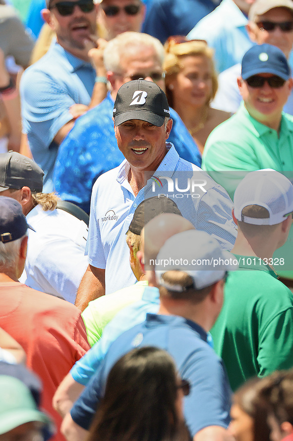 Matt Kuchar of Jupiter, Florida greets fans as he walks off the course after completing the first round of the The Memorial Tournament prese...