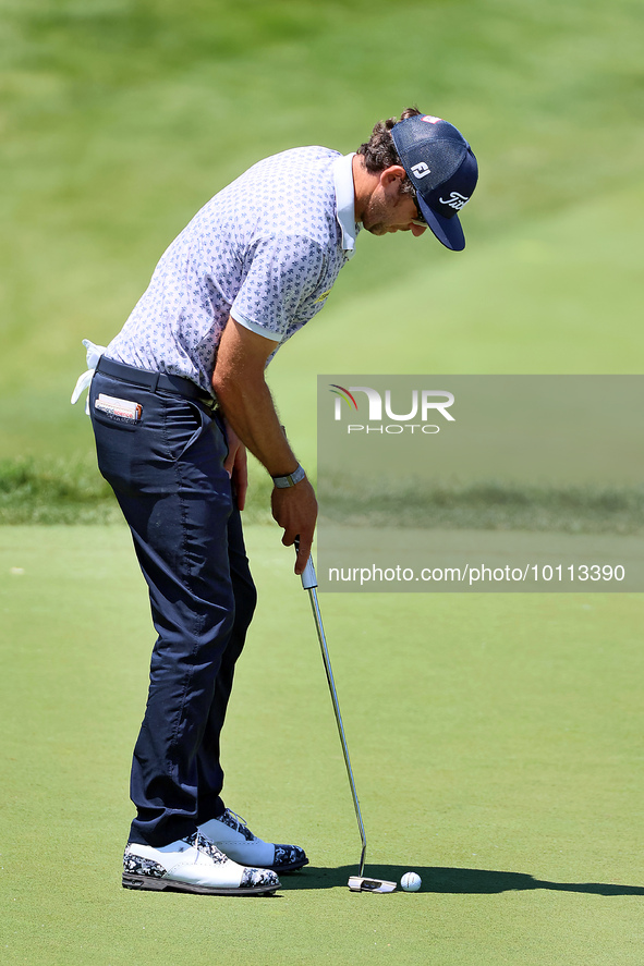 Lanto Griffin of Jacksonville Beach, Florida lines up his putt on the 18th green during the first round of the The Memorial Tournament prese...