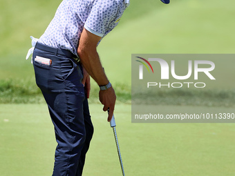 Lanto Griffin of Jacksonville Beach, Florida lines up his putt on the 18th green during the first round of the The Memorial Tournament prese...