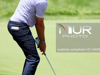 Lanto Griffin of Jacksonville Beach, Florida chips onto the 18th green during the first round of the The Memorial Tournament presented by Wo...