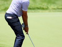 Lanto Griffin of Jacksonville Beach, Florida chips onto the 18th green during the first round of the The Memorial Tournament presented by Wo...