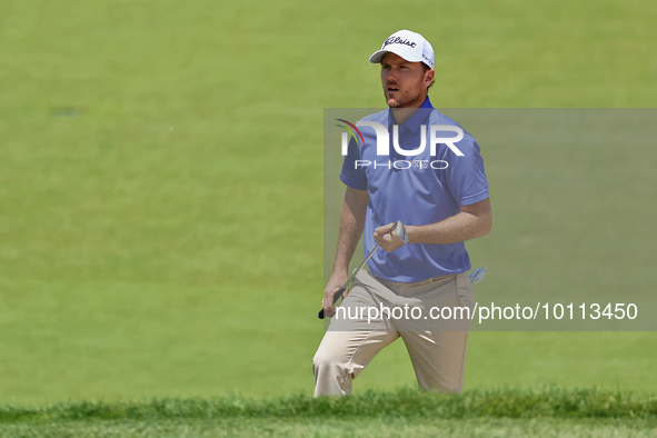 Russell Henley of Columbus, Georgia walks up to the 18th green during the first round of the The Memorial Tournament presented by Workday at...