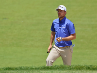 Russell Henley of Columbus, Georgia walks up to the 18th green during the first round of the The Memorial Tournament presented by Workday at...