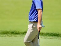 Russell Henley of Columbus, Georgia waits on the 18th green during the first round of the The Memorial Tournament presented by Workday at Mu...