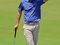 Russell Henley of Columbus, Georgia waits on the 18th green during the first round of the The Memorial Tournament presented by Workday at Mu...