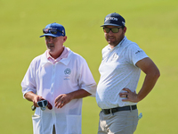 Matt NeSmith of Aiken, South Carolina waits with his caddie at the 18th green during the first round of the The Memorial Tournament presente...