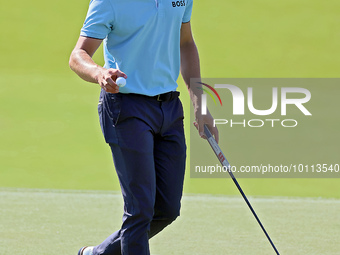 Thomas Detry of Brussels, Belgium walks off the 18th green during the first round of the The Memorial Tournament presented by Workday at Mui...