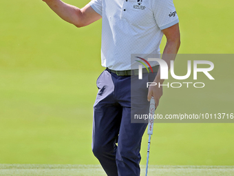 Luke Donald of England acknowledges the crowd after putting on the 18th green during the first round of the The Memorial Tournament presente...