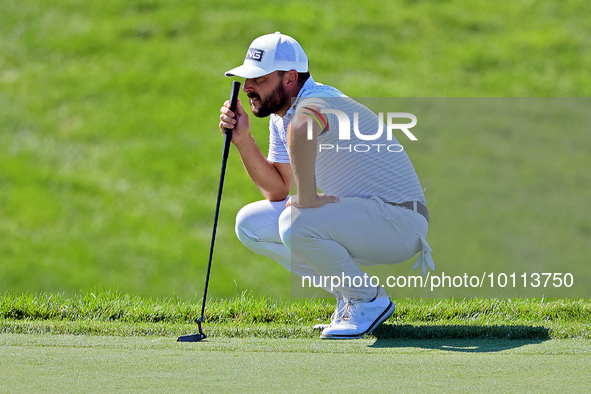 Stephan Jaeger of Germany lines up his putt on the 18th green during the first round of the The Memorial Tournament presented by Workday at...