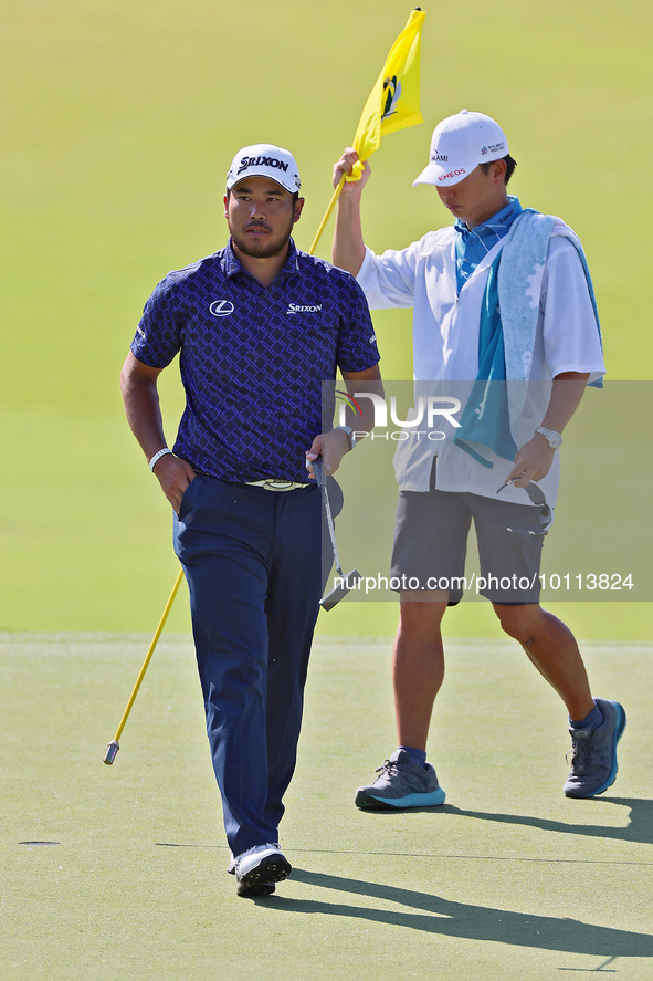 HIdeki Matsuyama of Sendai, Japan walks on the 18th green during the first round of the The Memorial Tournament presented by Workday at Muir...