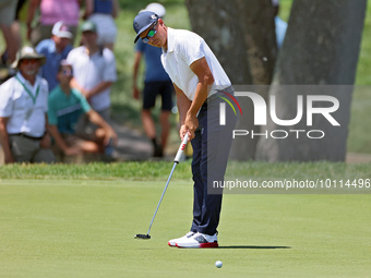 Rickie Fowler of Murrieta California putts on the 5th green during The Memorial Tournament presented by Workday at Muirfield Village Golf Cl...