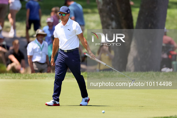 Rickie Fowler of Murrieta California reacts after putting on the 5th green during The Memorial Tournament presented by Workday at Muirfield...