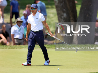 Rickie Fowler of Murrieta California reacts after putting on the 5th green during The Memorial Tournament presented by Workday at Muirfield...