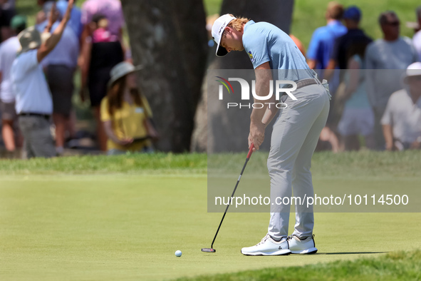 Sam Burns of Shreveport, Louisiana putts on the 5th green during The Memorial Tournament presented by Workday at Muirfield Village Golf Club...