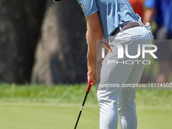 Sam Burns of Shreveport, Louisiana putts on the 5th green during The Memorial Tournament presented by Workday at Muirfield Village Golf Club...