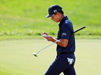 Justin Suh of San Jose, California marks his card as he walks off the 18th green after completing the  second round during  The Memorial Tou...