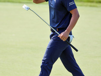 Justin Suh of San Jose, California acknowledges the fans as he walks on the 18th green after putting during  The Memorial Tournament present...