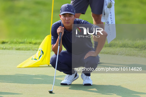 Justin Suh of San Jose, California lines up his putt on the 18th green during the second round during  The Memorial Tournament presented by...